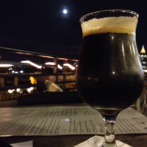 Full moon hangs over the Atlanta skyline from 5 West's Skybar patio.