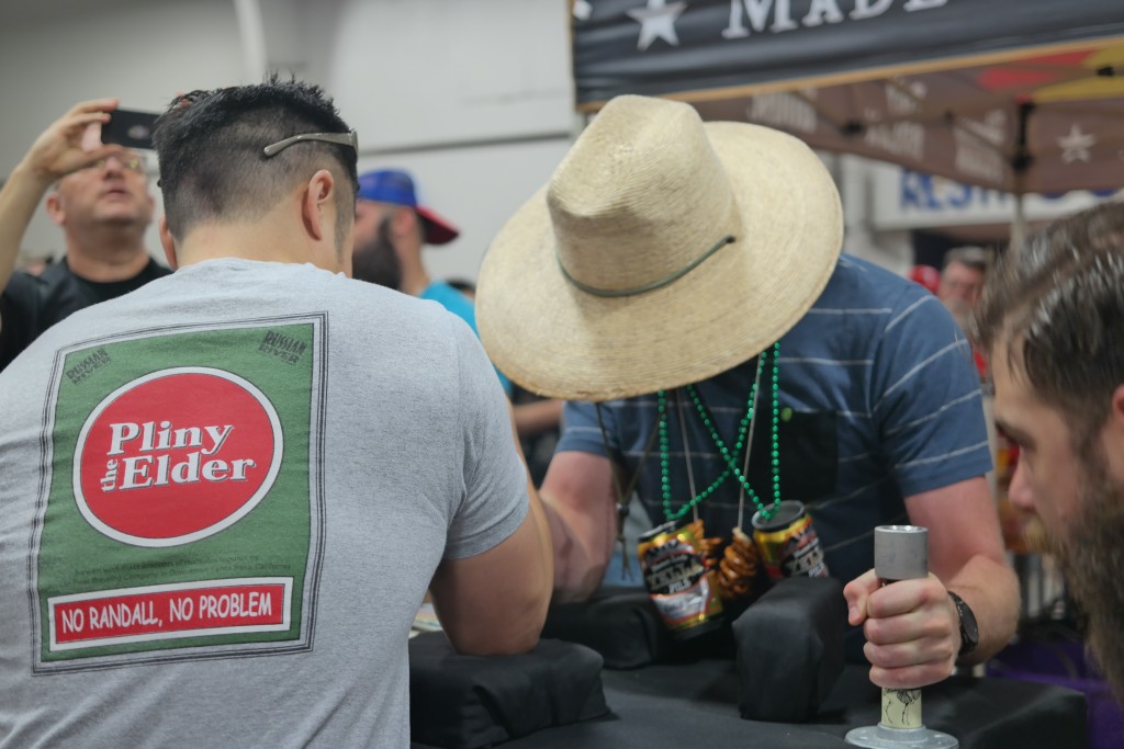 Test of Strength, arm wrestling over at the Martin House booth. 