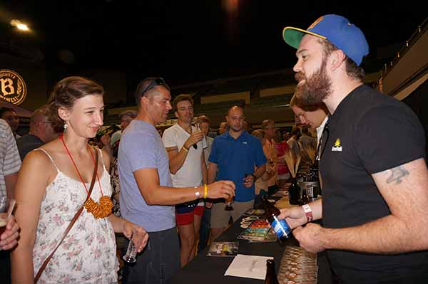 Green Flash rep speaking with festival attendees