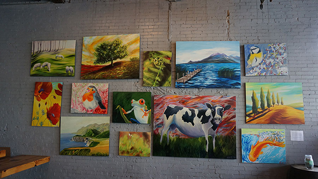 Reproductions of Sara Papp's work on display at Creature Comforts Brewing Co. in Athens, Georgia. (Photo: John Pylant)
