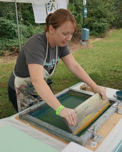 Double Dutch Press employee conducting a screen transfer of Hop Harvest poster.