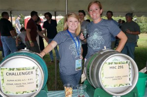Two Terrapin Beer Co. employees pose next to two cask ale offerings under the cask ale tent.