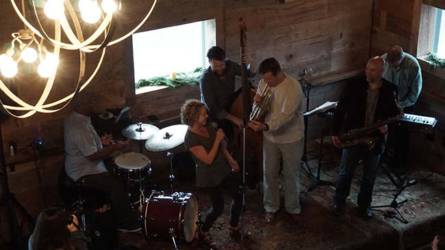 Susie Spear Purcell sings with Joe Grandsen and band at the Three Taverns Holiday Party. (Chris Powell/PorchDrinking.com)