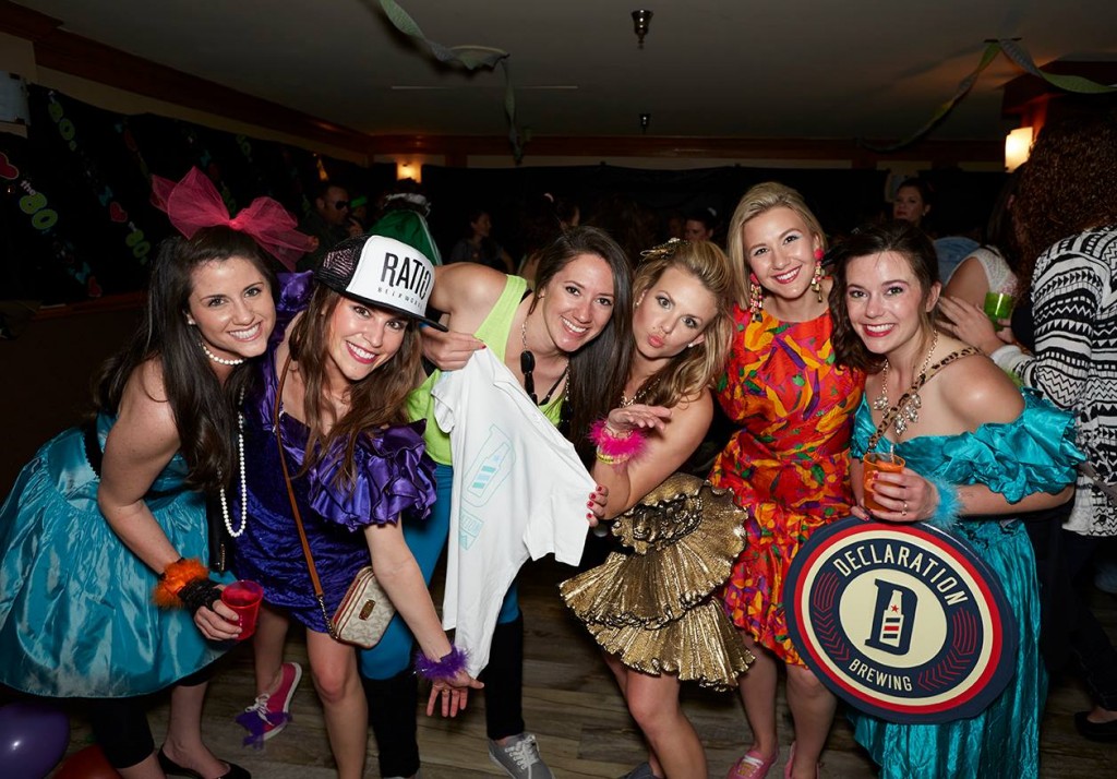 A group of women dressed in 80s themed outfits at the 2015 News Kids on the Block festival