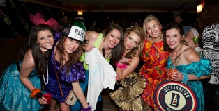 A group of women dressed in 80s themed outfits at the 2015 News Kids on the Block festival