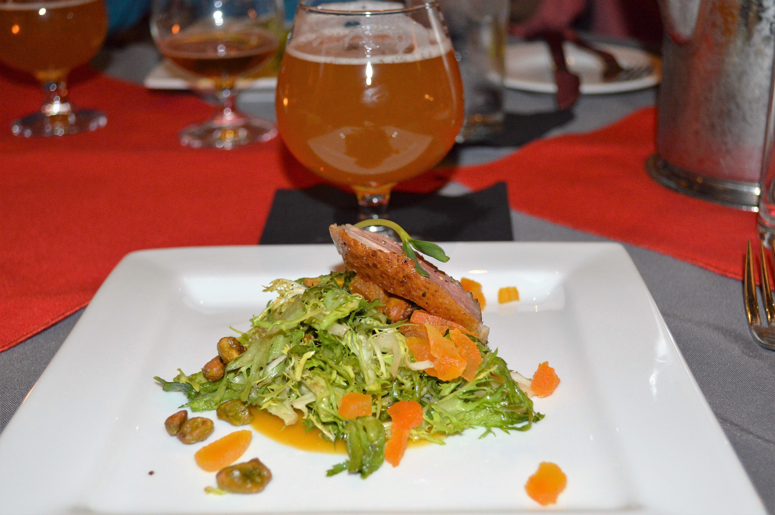 Candied pistachio, dried apricot, seasoned frisee, smoked duck breast, and sunflower sprouts with a honey citrus vinaigrette
