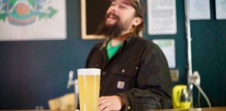 Adam Kandle laughs behind the bar at Adamant Brewing and Blending, his new brewery in North Boulder, on Wednesday, March 20, 2019. Adamant Brewing & Blending Opens in Boulder’s Former Cellar West