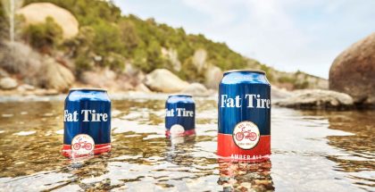 New Belgium Brewing Fat Tire Cans in River