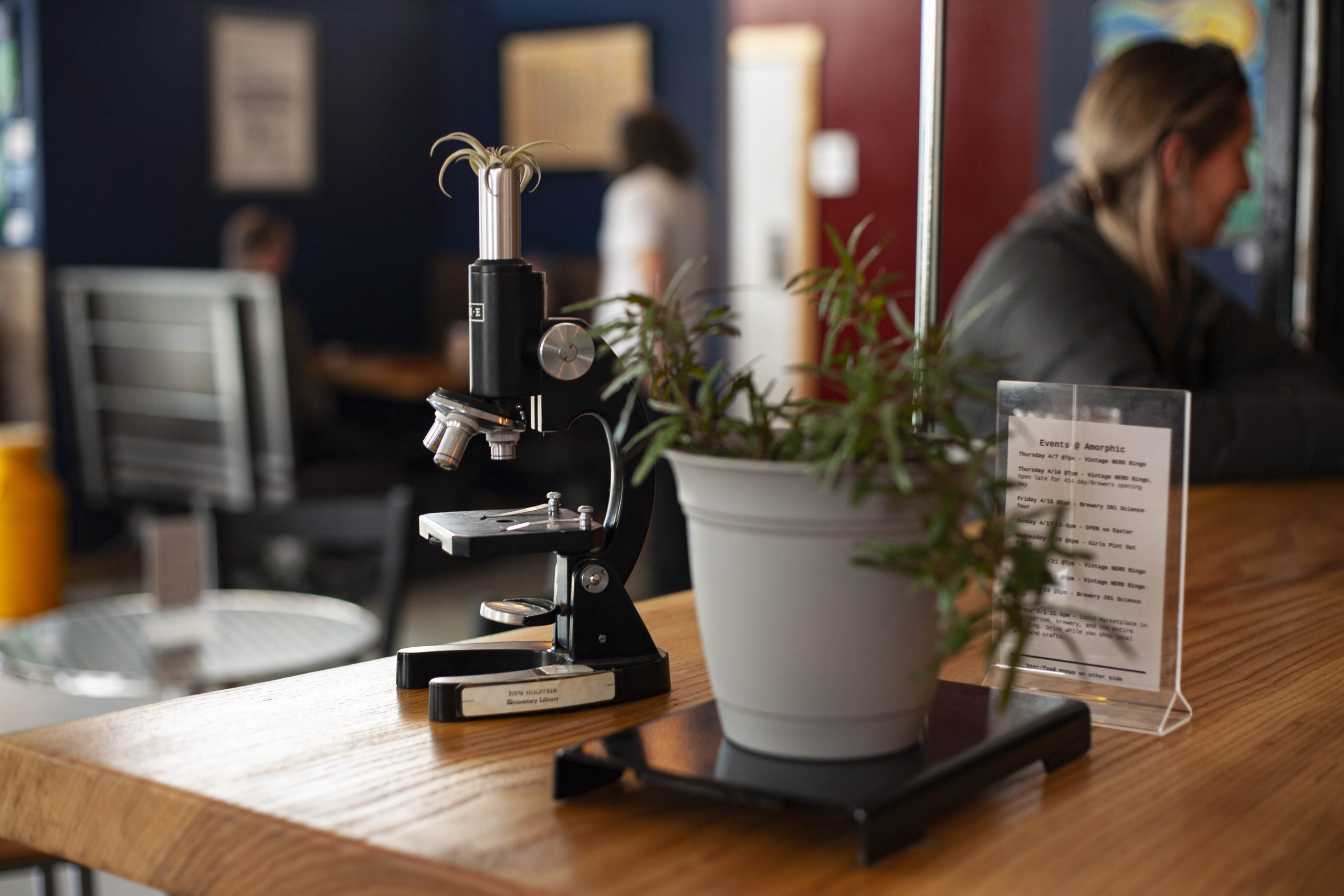 Retired science lab equipment is repurposed as table decor.