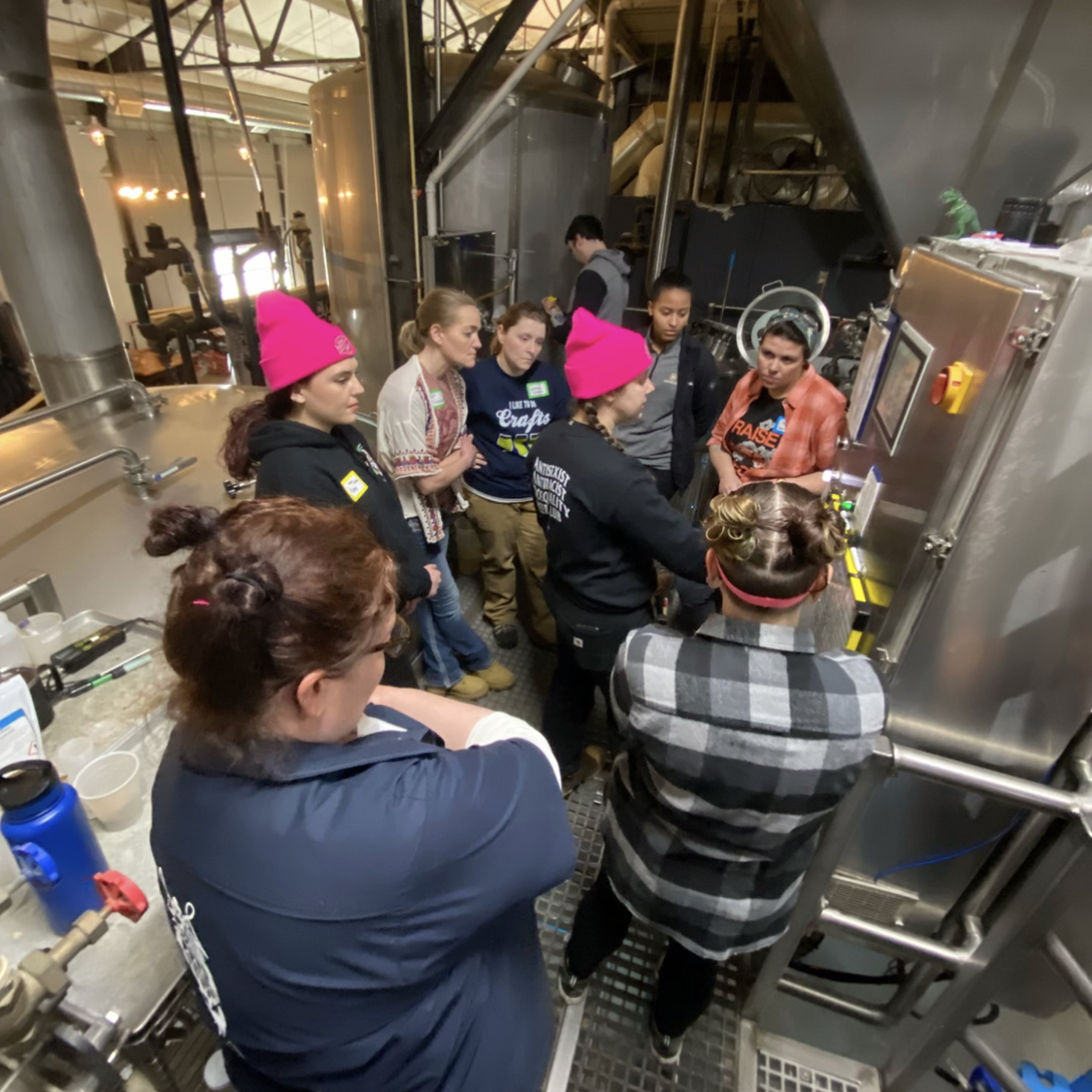 A group of women observe the brew day at Third Space Brewing