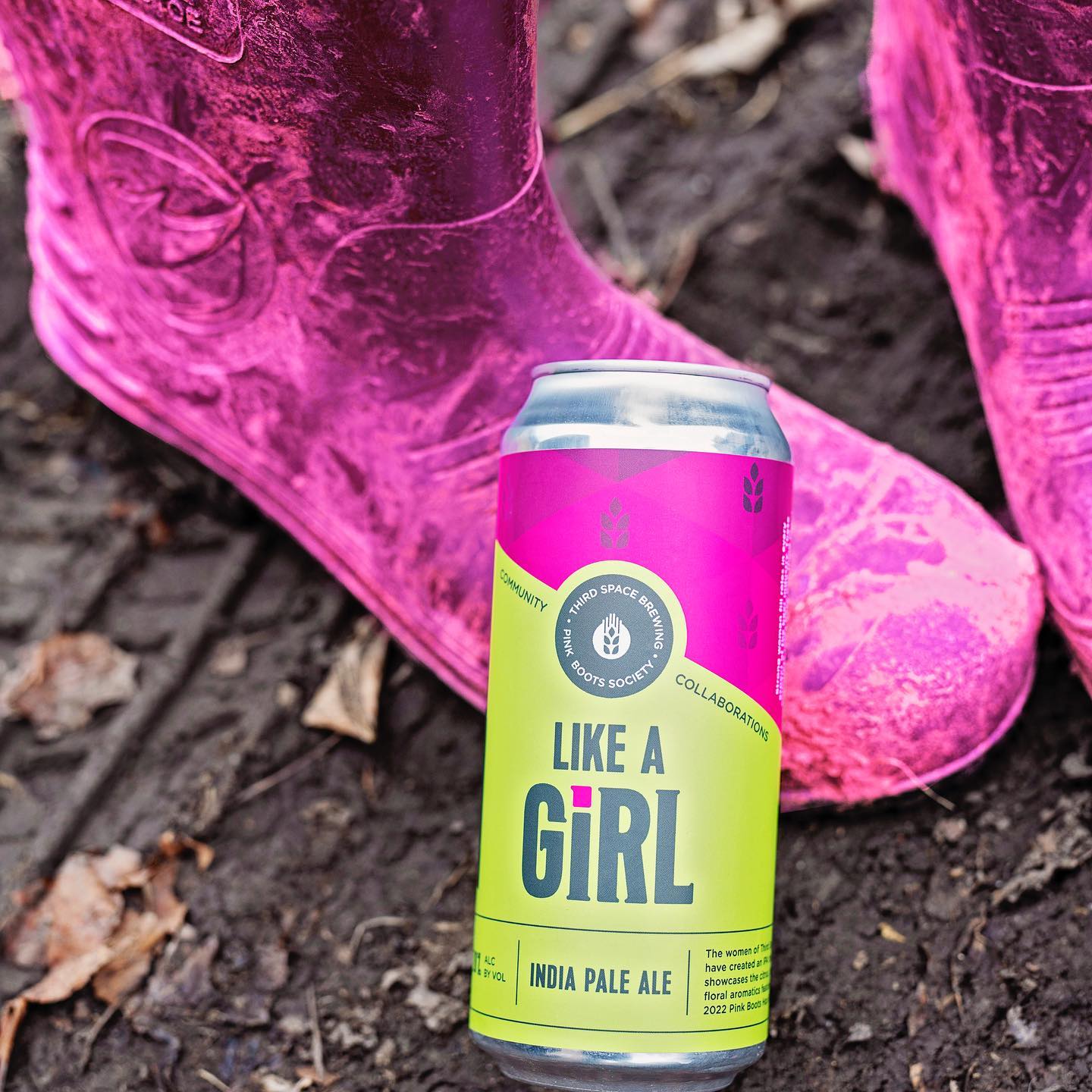 A can of Like A Girl IPA rests on a well-worn pink rainboot