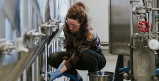 Student working in brewery