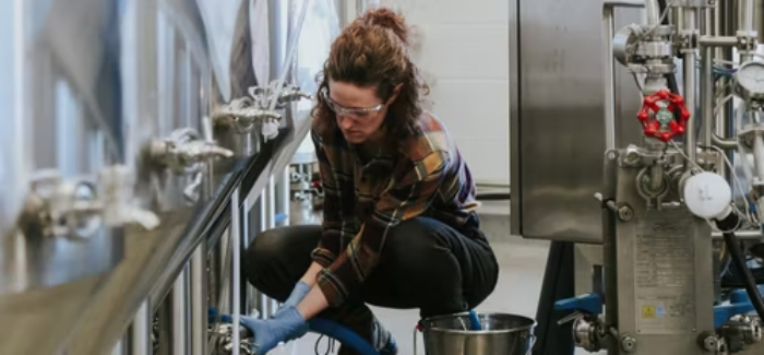 Student working in brewery