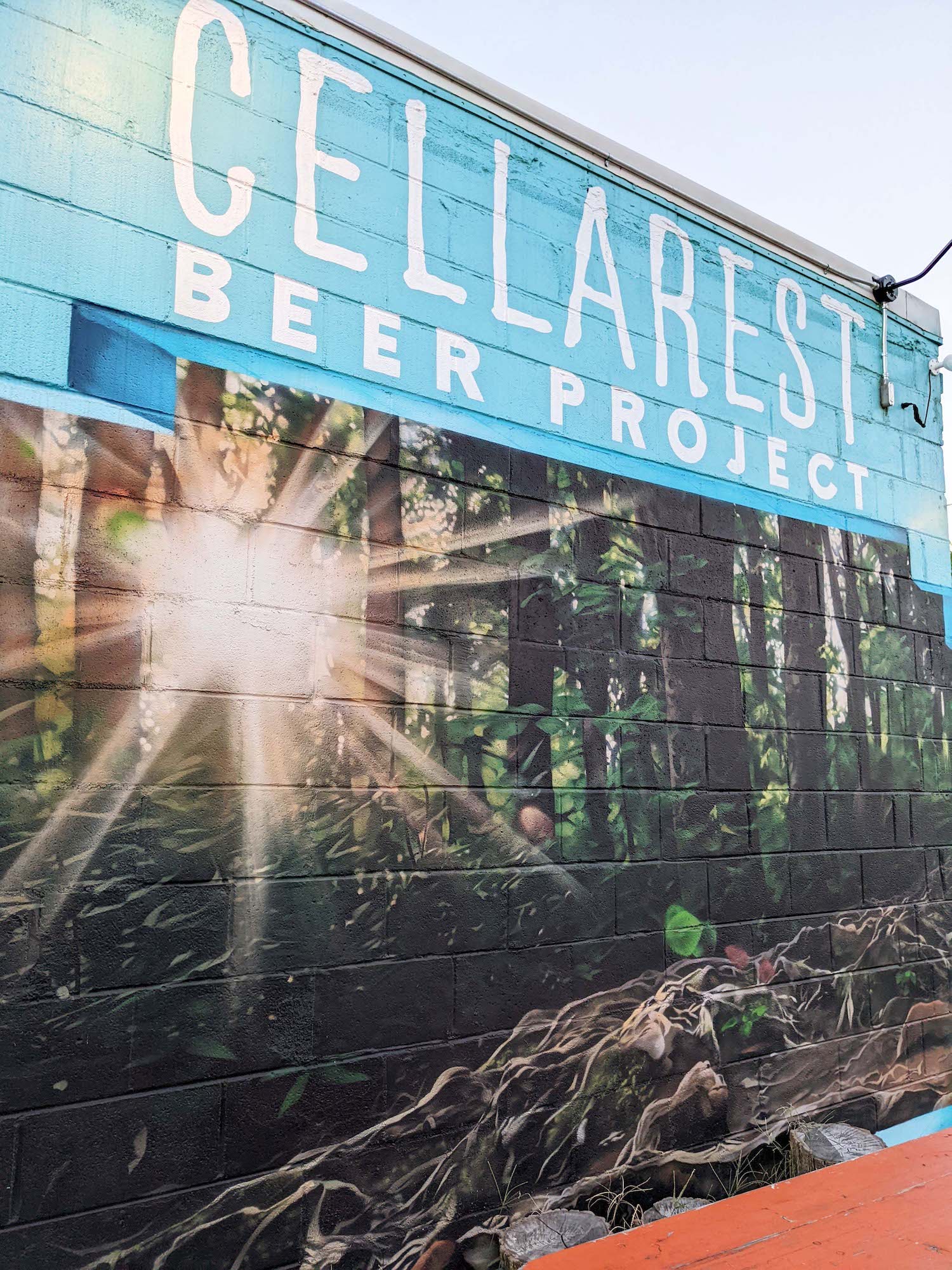Cellarest Beer Project Mural with brewery name and forest scene