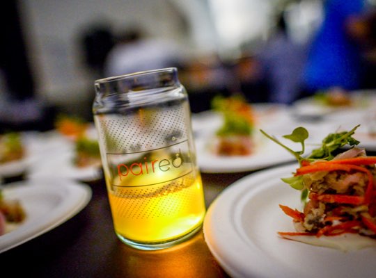 paired glass alongside plate of food