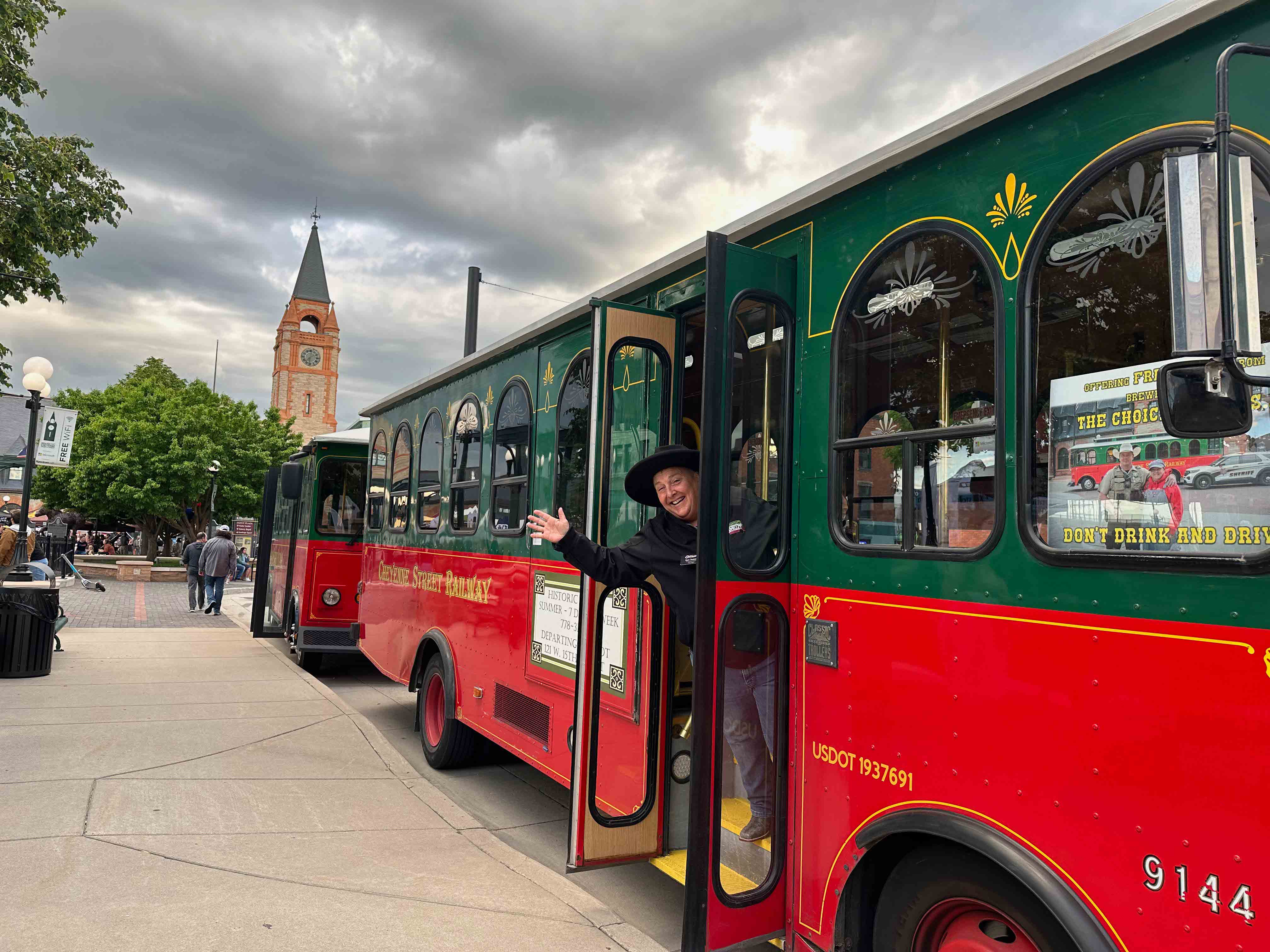 Sue James, transportation manager for the Cheyenne Street Railway Trolley, was among the drivers offering Wyoming Brewers Festival attendees a safe ride home. Here, she invites riders aboard Esther, one of the company’s four trolleys and named for Esther Hobart Morris, the first woman to serve as justice of the peace in the U.S. During the festival, the Laramie County Sheriff’s Department and Cheyenne Regional Medical Center sponsored rides home within city limits to festival attendees. Photo Credit: Amber Leberman 