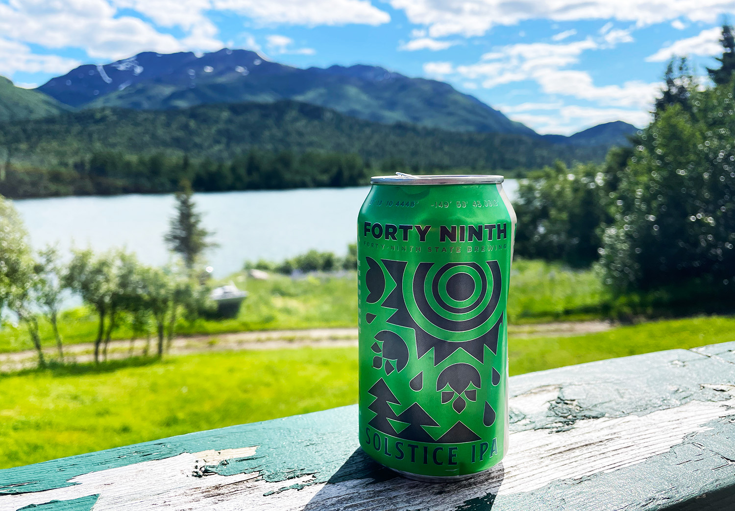 Solstice IPA sitting on railing in Alaska