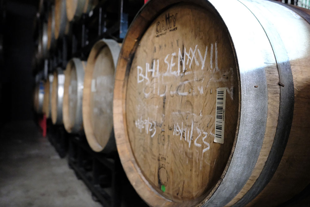 Angled view of Floodland's racked barrels