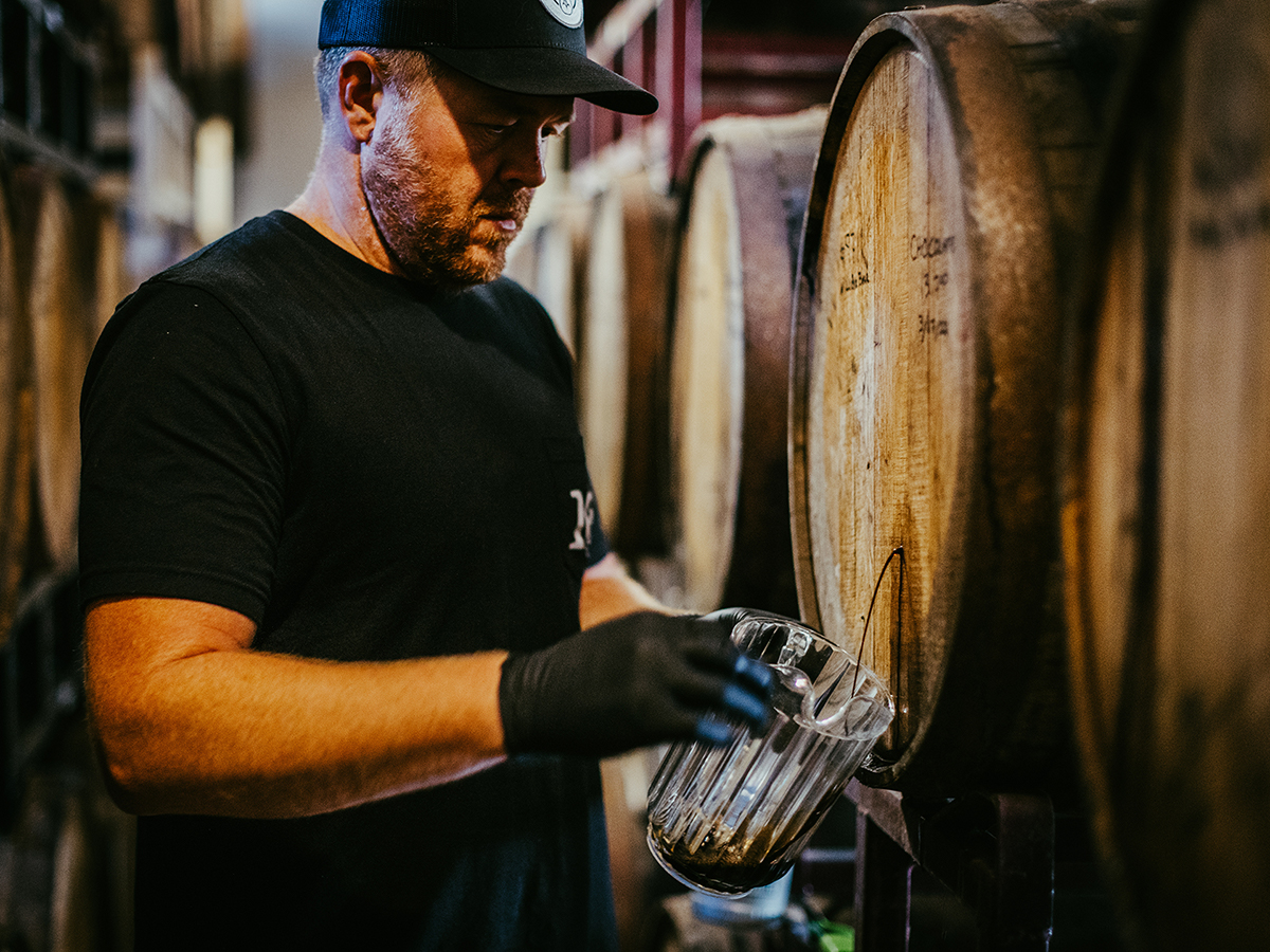 Cory King pouring samples from Side Project's Barrel Room