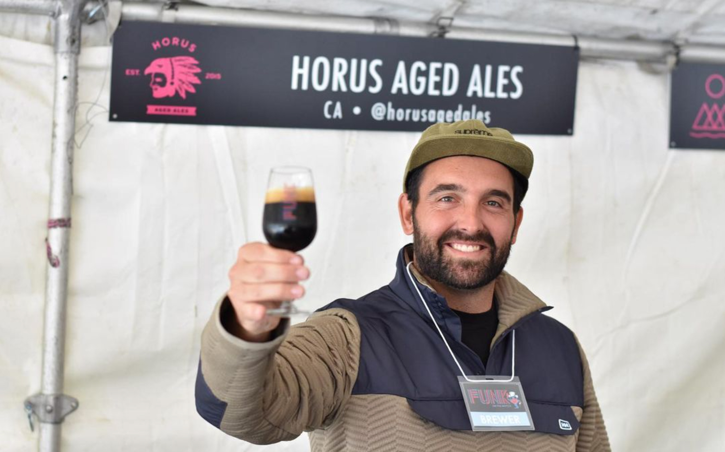 Kyle throwing cheers to attendees of Burlington's Funk ON The Water, 2019